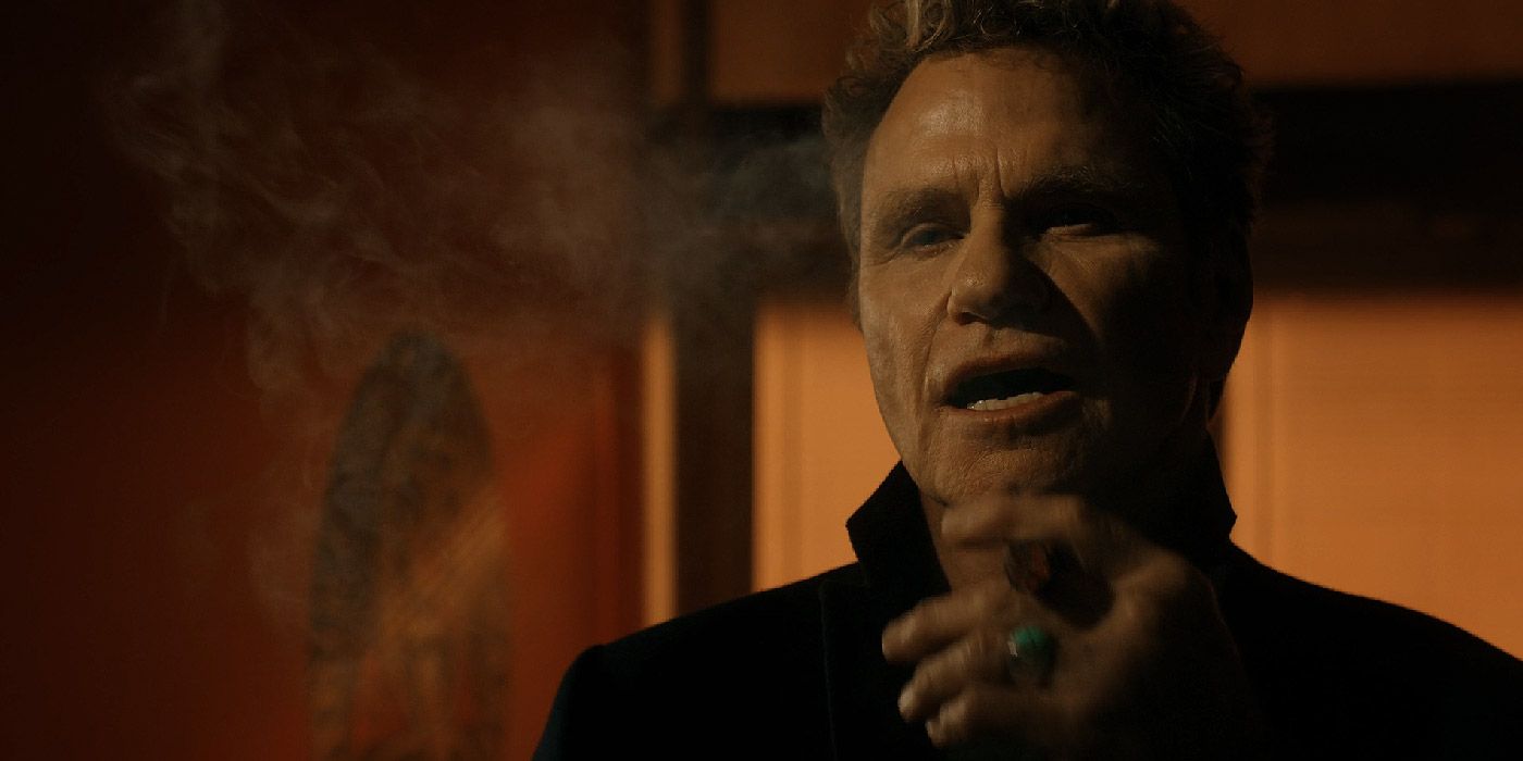 John Kreese smoking a cigar in Cobra Kai