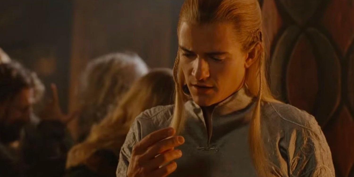 Legolas looking at his fingers during the drinking game in The Lord of the Rings