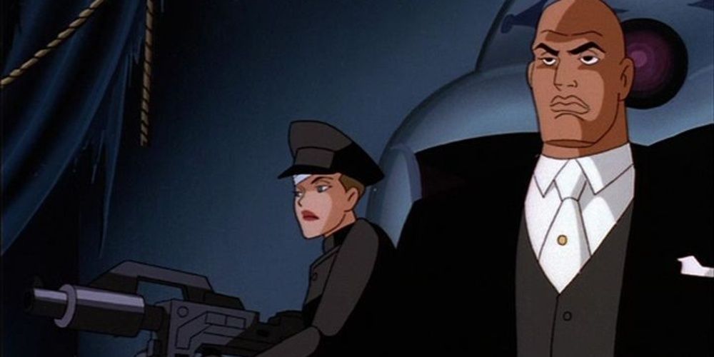 Lex Luthor watches Mercy Graves wield a gun in Superman the Animated Series 