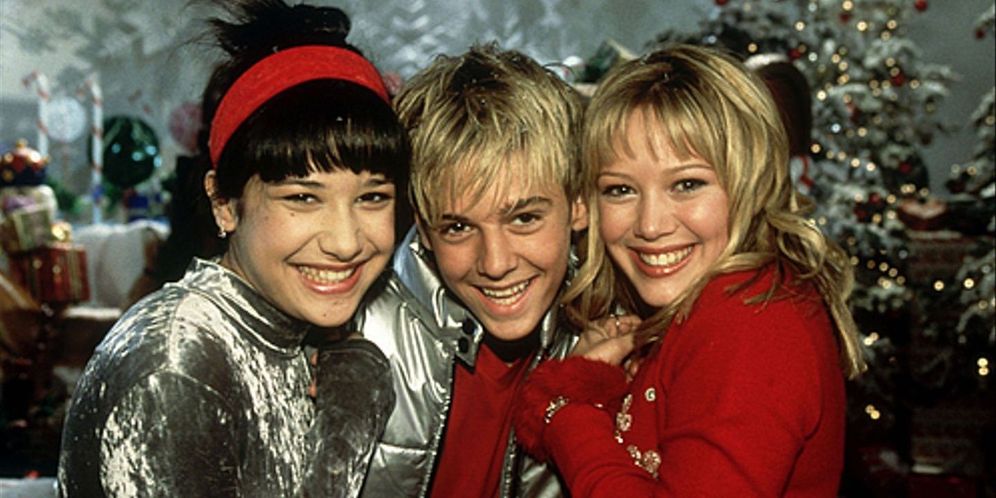 Lizzie McGuire takes a photo with her friend and Aaron Carter 