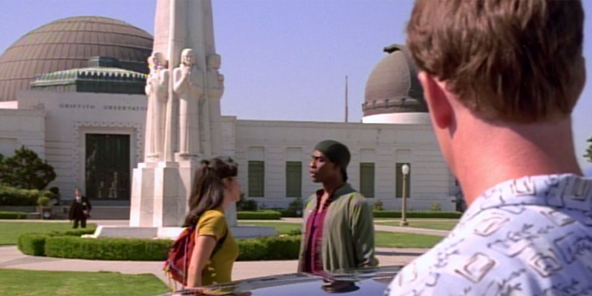 Tom Paris watches a pair of people argue in front of the Griffith Observatory from Star Trek Voyager