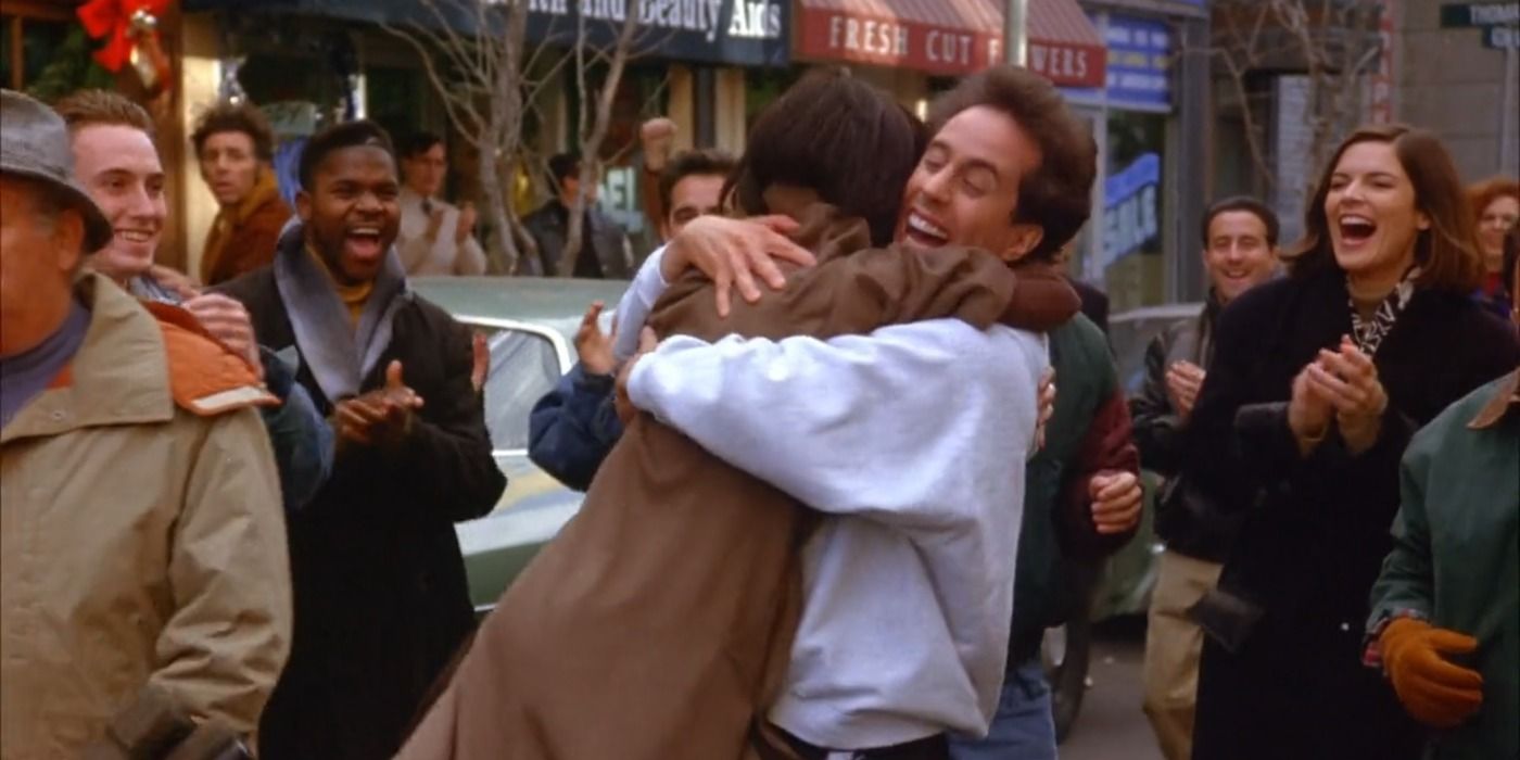 Jerry hugs Lois after winning footrace against her boss Duncan Meyer in Seinfeld