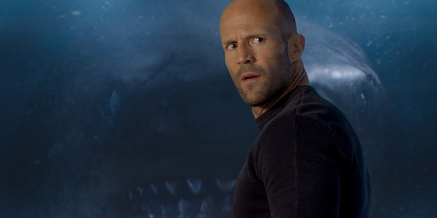 Jason Statham standing in front of the shark in The Meg