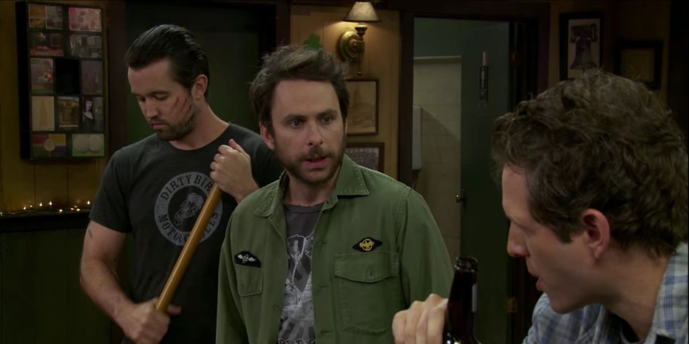 Mac, Charlie and Dennis standing in the bar in It's Always Sunny in Philadelphia.
