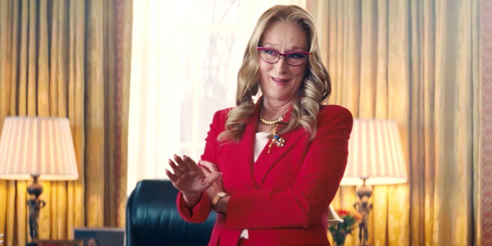 Meryl Streep as a overconfident president in a red outfit in Don't Look Up