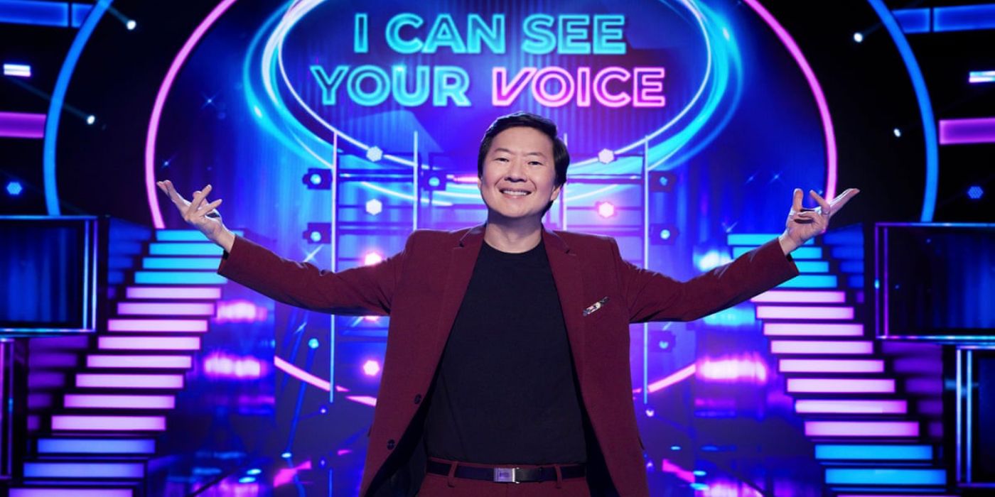 Ken Jeong standing and spreading his arms in I Can See Your Voice