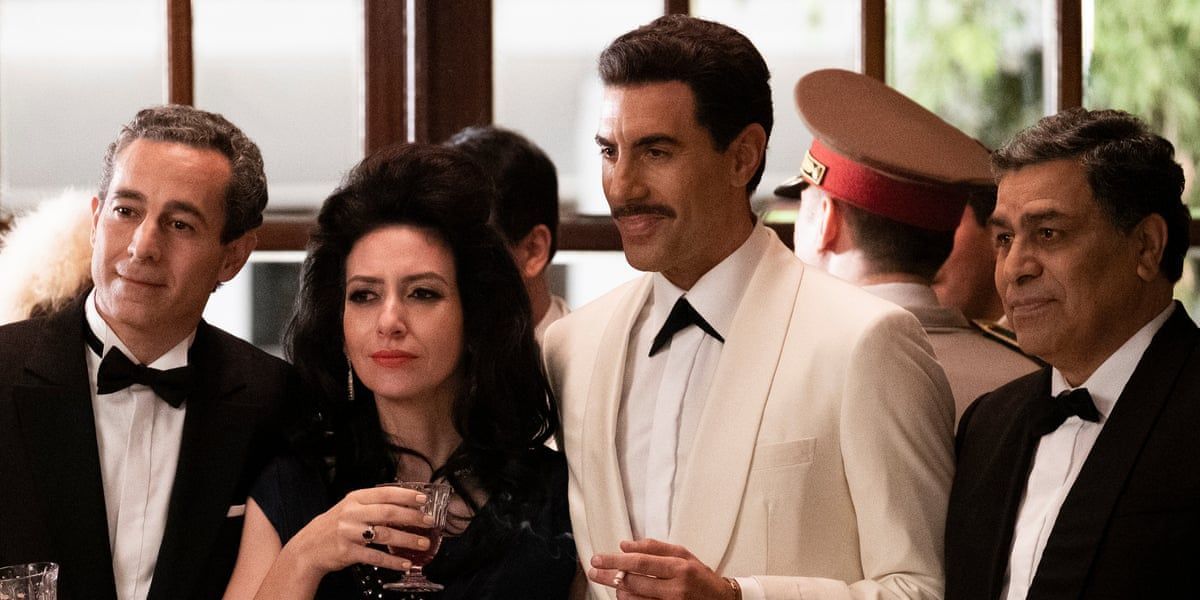 Sacha Baron Cohen as Eli Cohen at a party in Netflix's The Spy