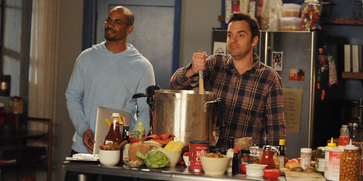 Two men make food in a kitchen in New Girl.