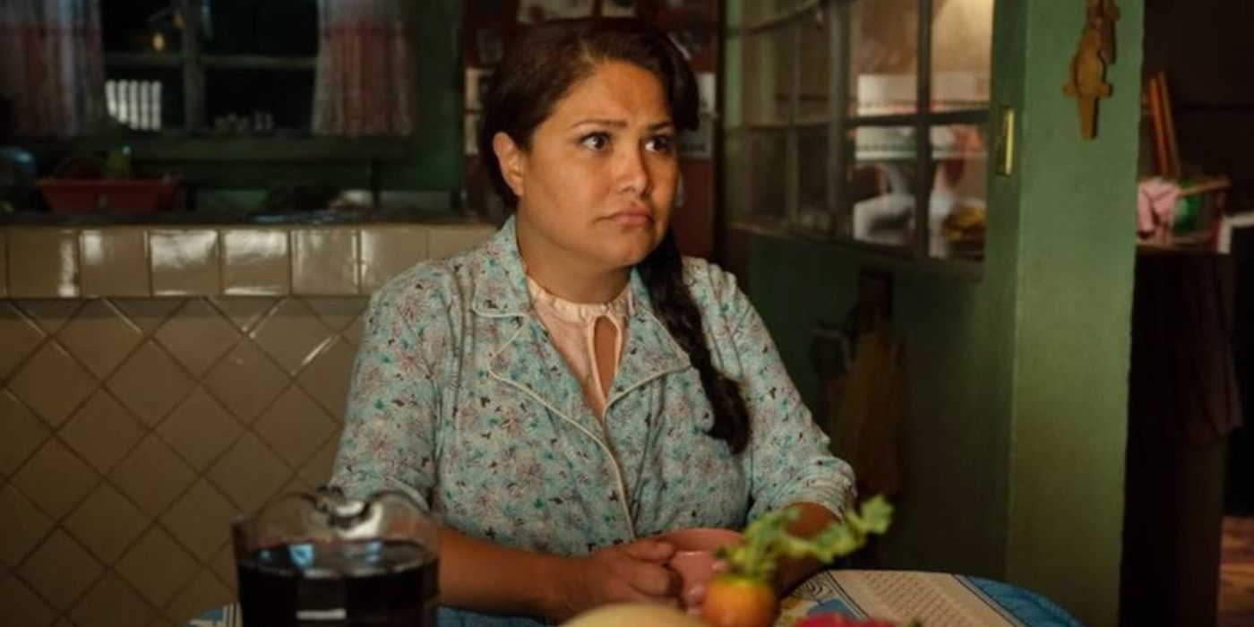 Nora sits at the table in Acapulco