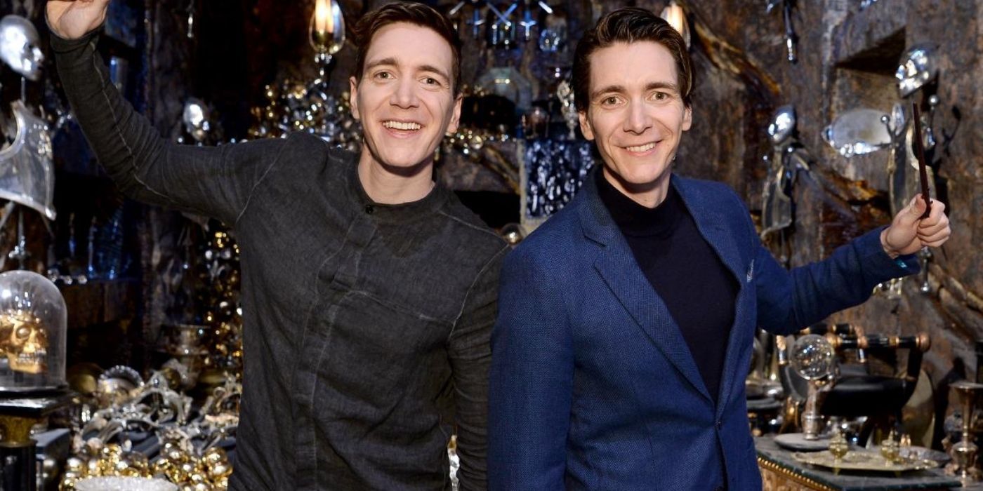 James and Oliver Phelps posing with HP merch