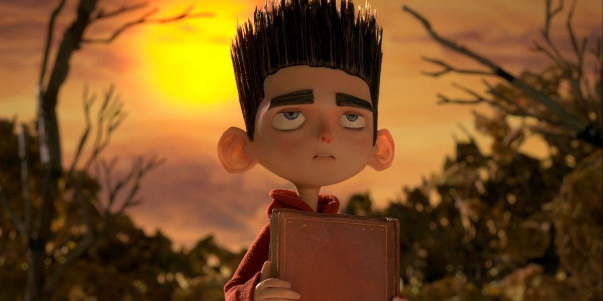 Norman holding a book in ParaNorman