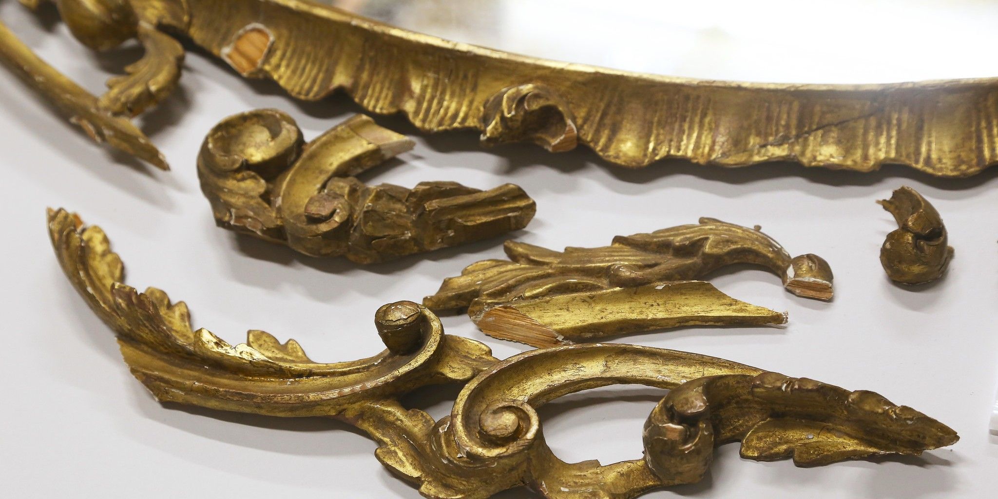 Pieces of a gilt frame for the definition of Gilded
