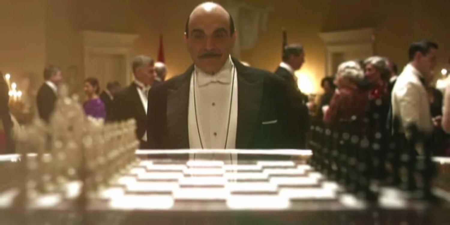 Poirot looking at a chessboard in The Big Four