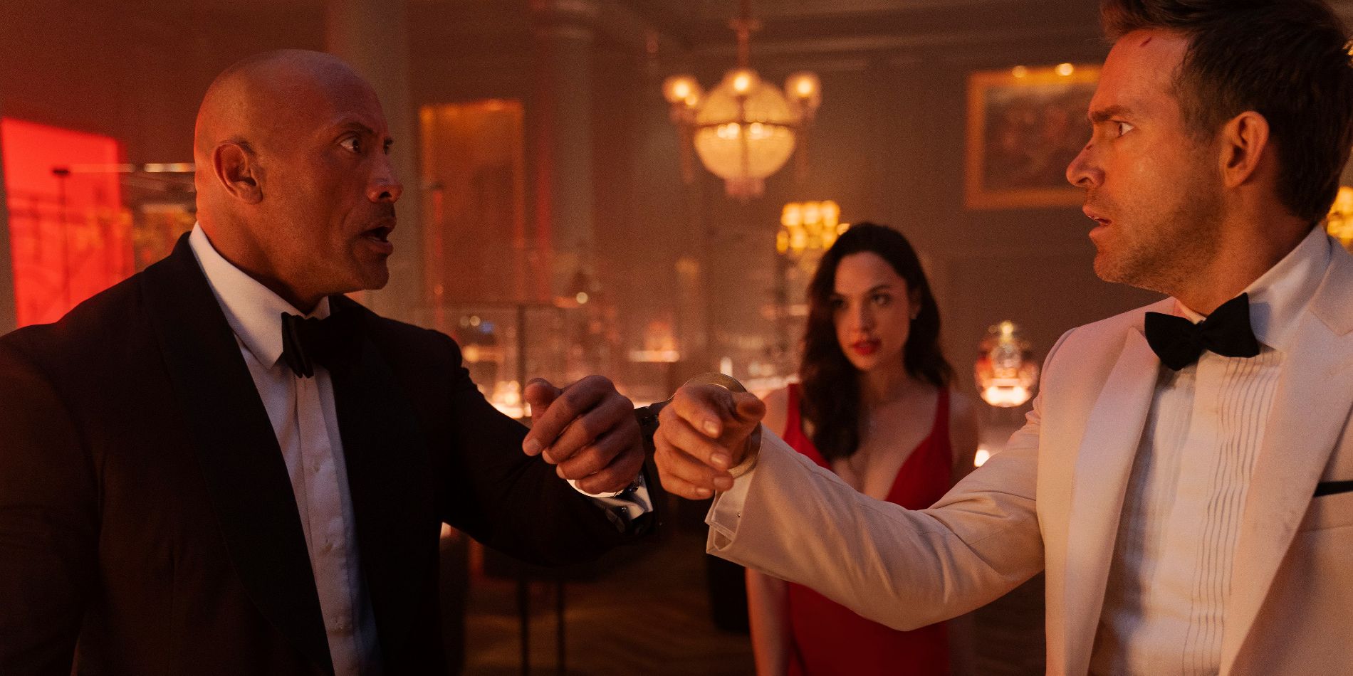Red Notice image with Dwayne Johnson, Ryan Reynolds, and Gal Gadot