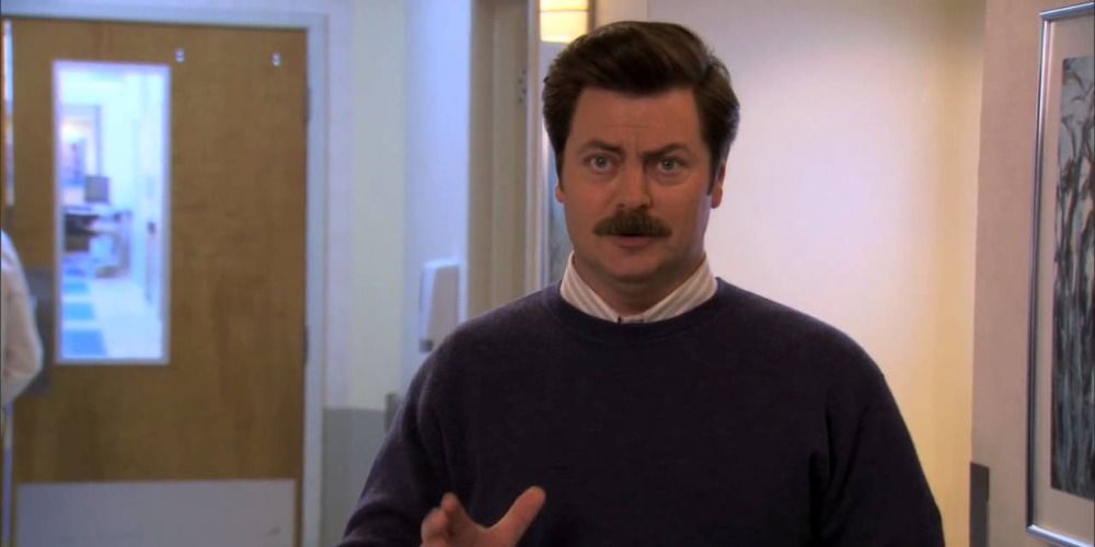 Ron talking with his hand up in Parks and Rec