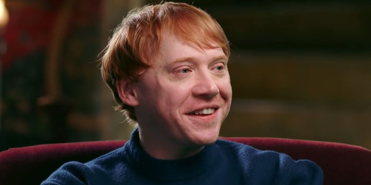 Rupert Grint smiles in the Gryffindor Common Room.