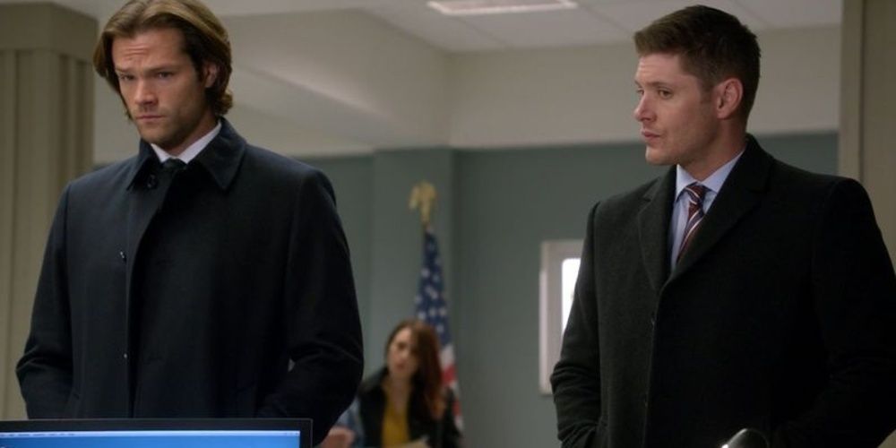 Sam and Dean wear trench coat suits in Supernatural