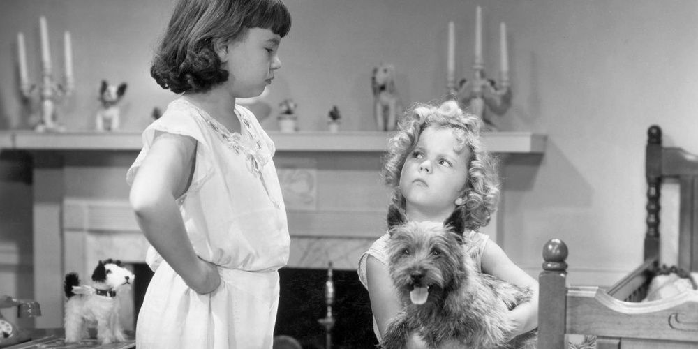 Shirley Temple's character looks sternly at her sister in Bright Eyes 