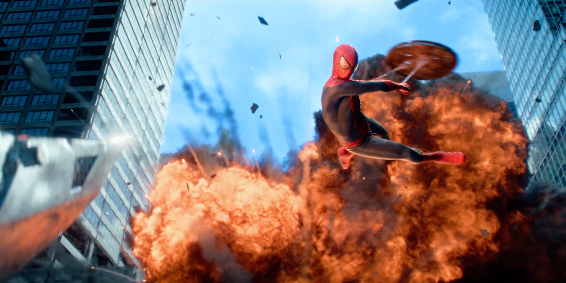 Spider-Man leaping in to fight Rhino with a manhole cover in The Amazing Spider-Man 2