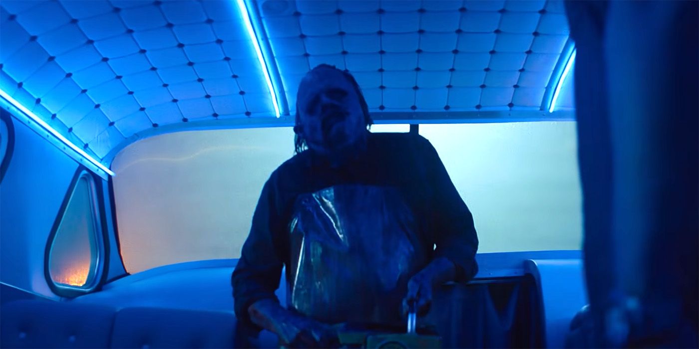 Leatherface steps onto the party bus in Texas Chainsaw Massacre