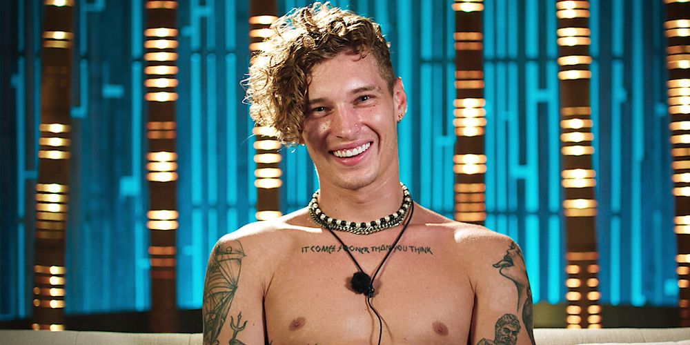 Stevan smiles while shirtless in the Too Hot To Handle Season 3 confessional room