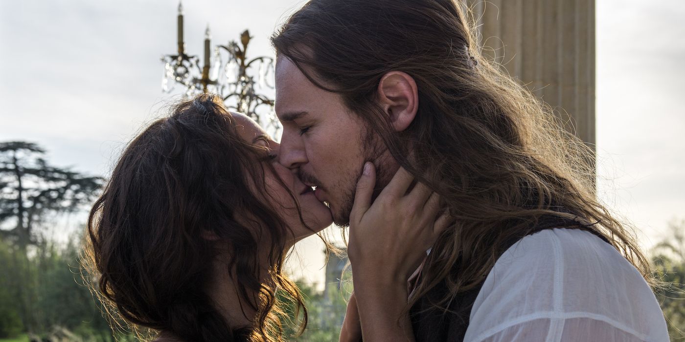 Kaya Scodelario and Benjamin Walker in The King's Daughter kissing passionately