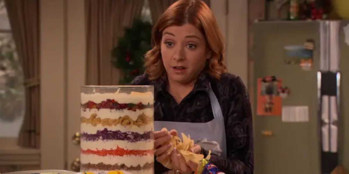 Lilly looks at a tower of food in How I Met Your Mother.