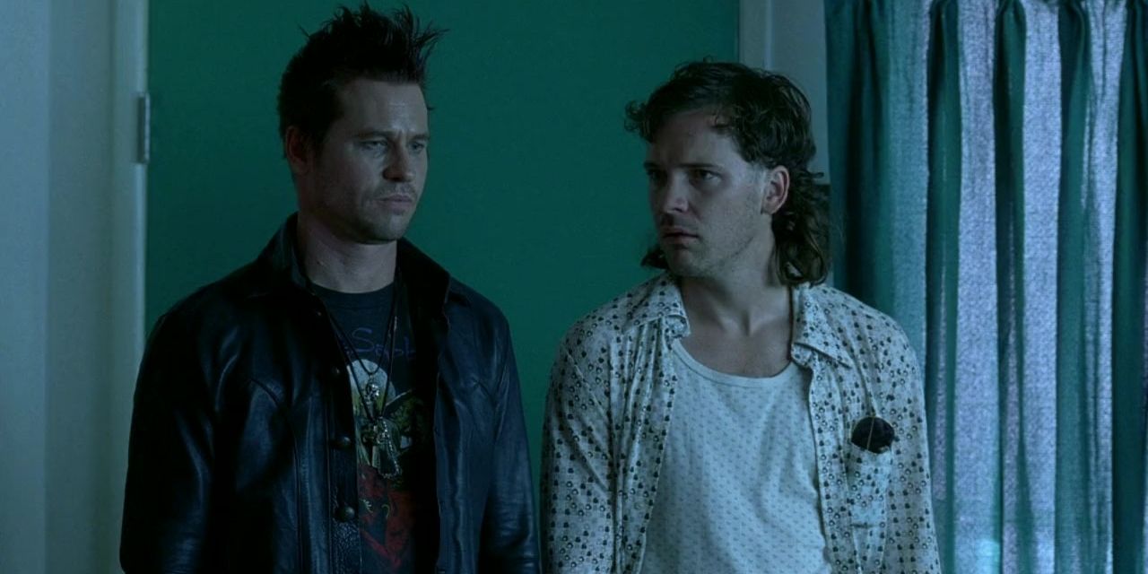 Val Kilmer and Peter Sarsgaard in a bedroom during a drug trip in The Salton Sea