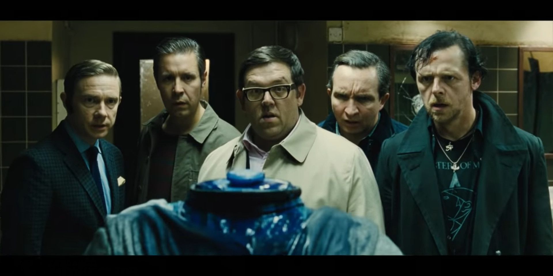 The five main cast members of The World's End with a headless robot.