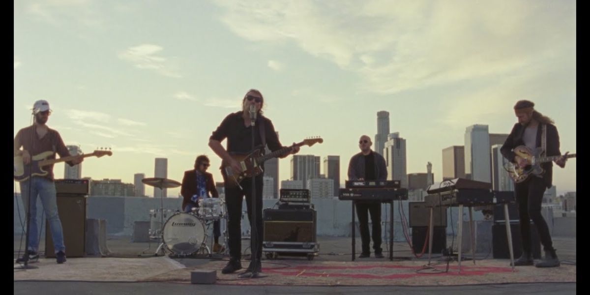 Shot of The War On Drugs playing on a rooftop 