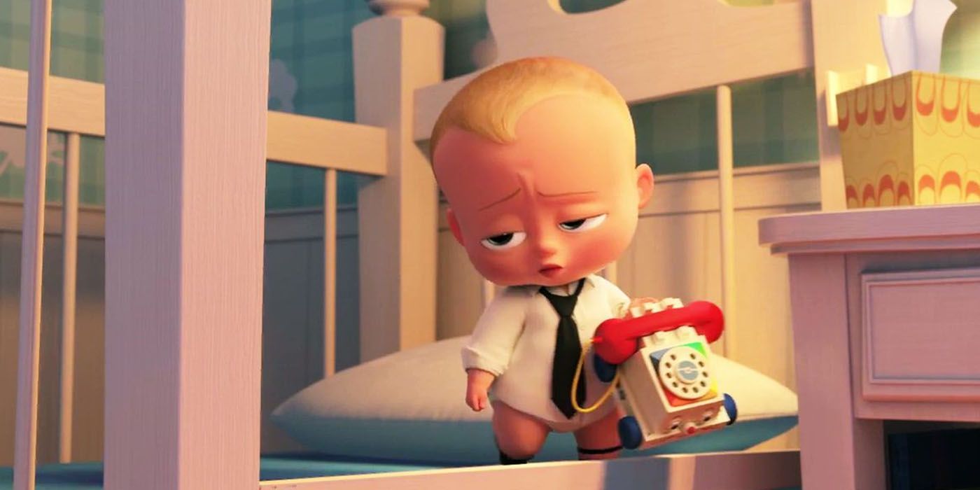 Theo from The Boss Baby holding toy phone and looking unimpressed