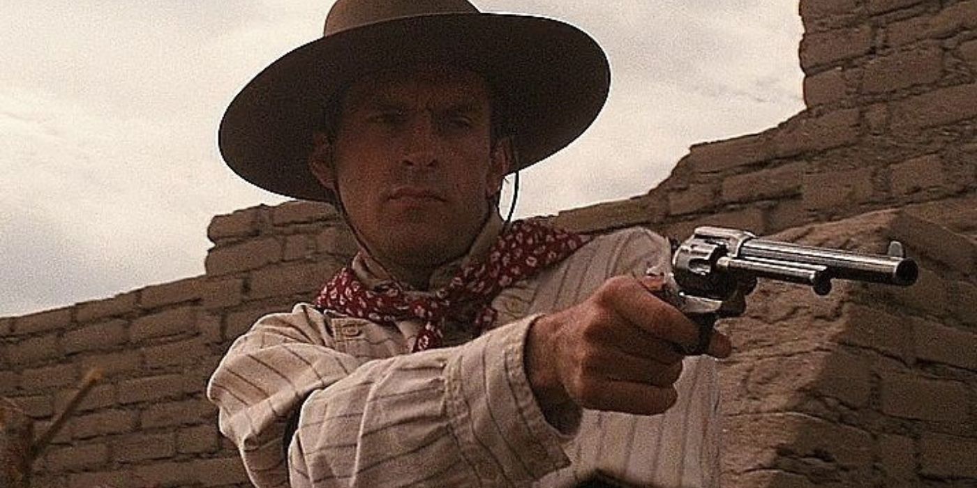 Frank Stilwell points his gun at Tombstone