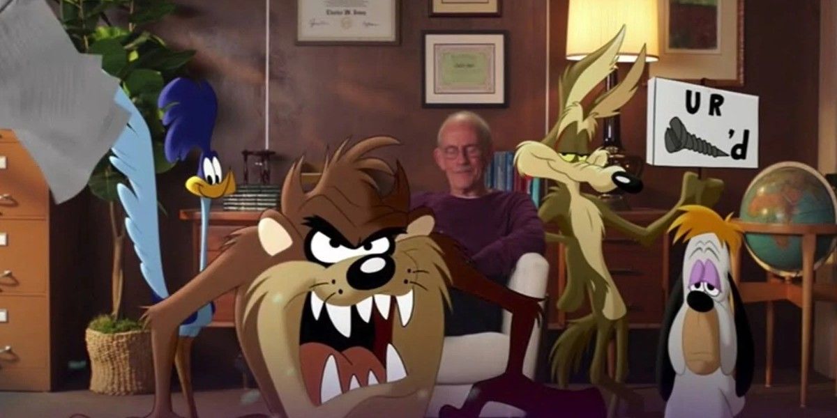 Christopher Lloyd surrounded by Looney Tunes
