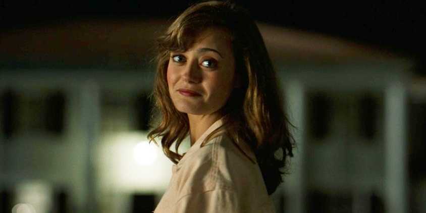 Jackie (Ella Purnell) looking back in front of her house in Yellowjackets season 2 episode 2.