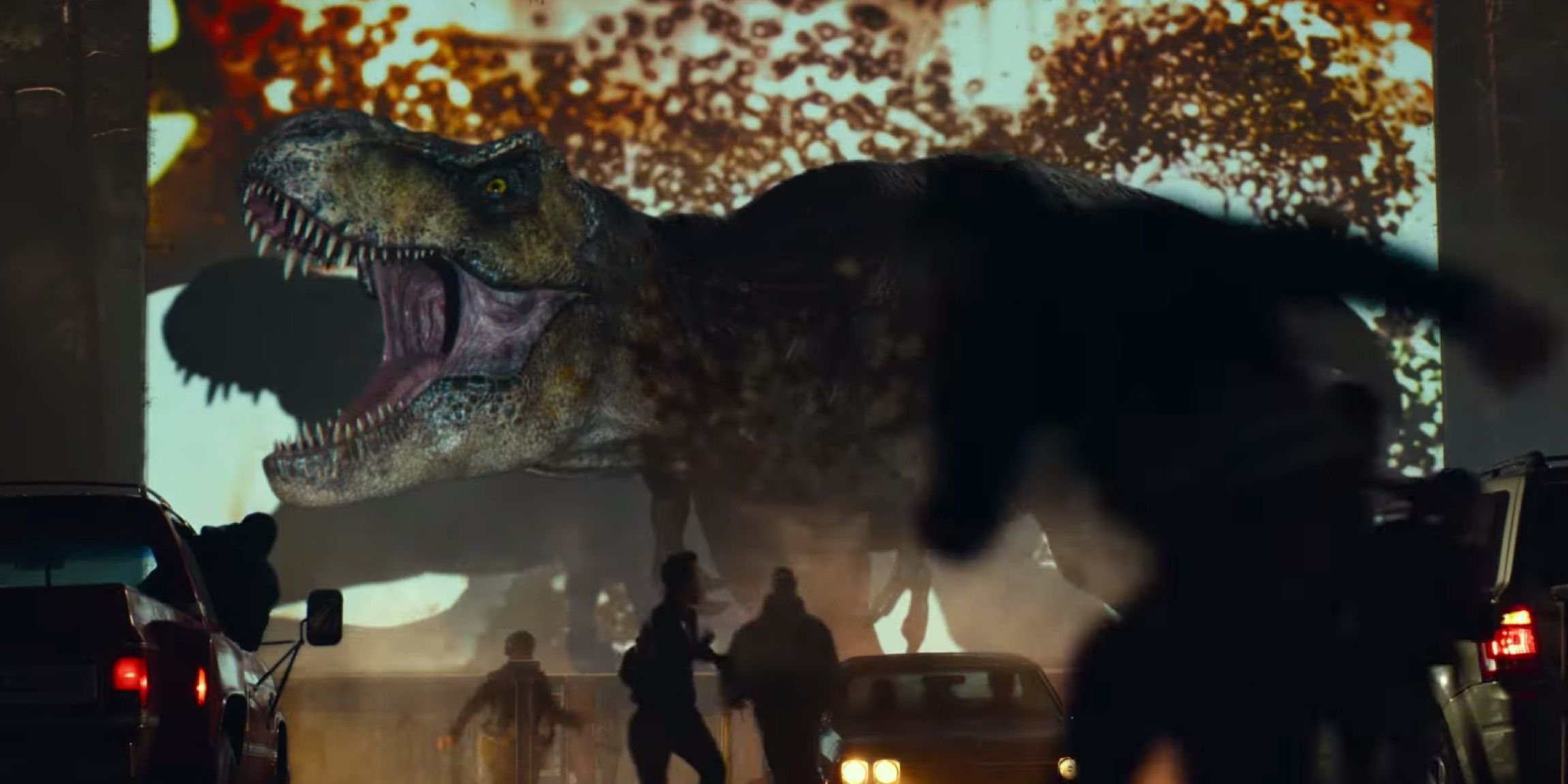 a dinosaur crashes a drive in theater in a prologue of Jurassic World Dominion