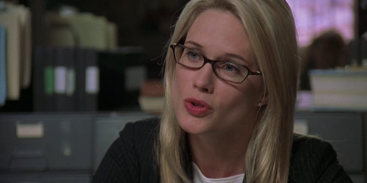 Alexandra Cabot wearing glasses at a desk in Law and Order: SVU