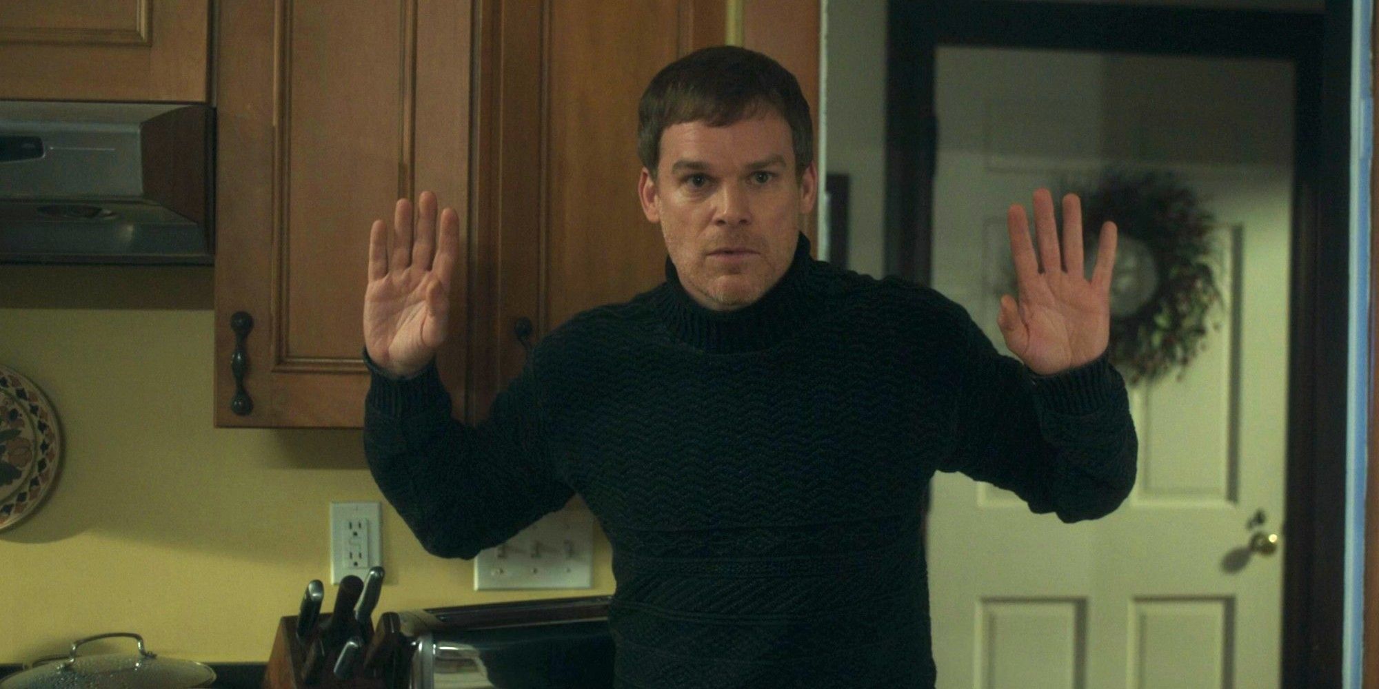 Dexter holds up his hands in New Blood.