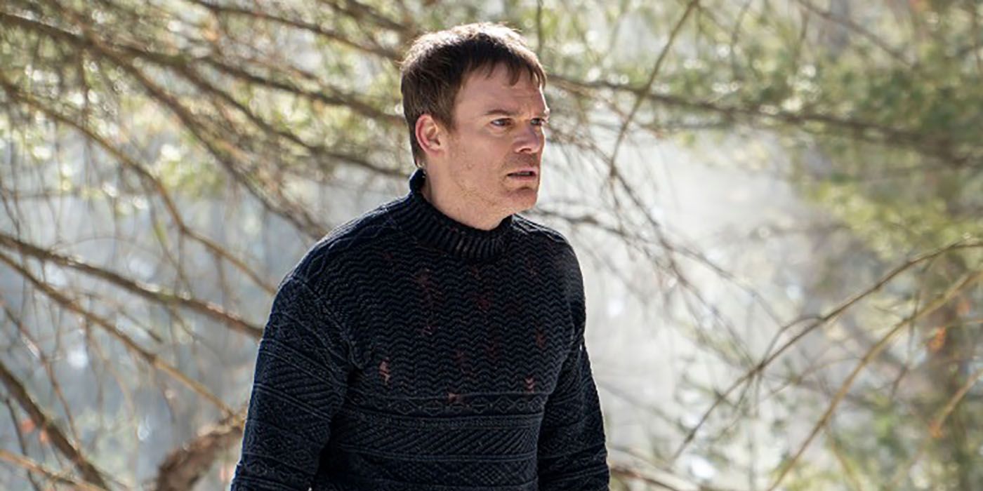Dexter standing in the woods, looking upset in Dexter: New Blood.