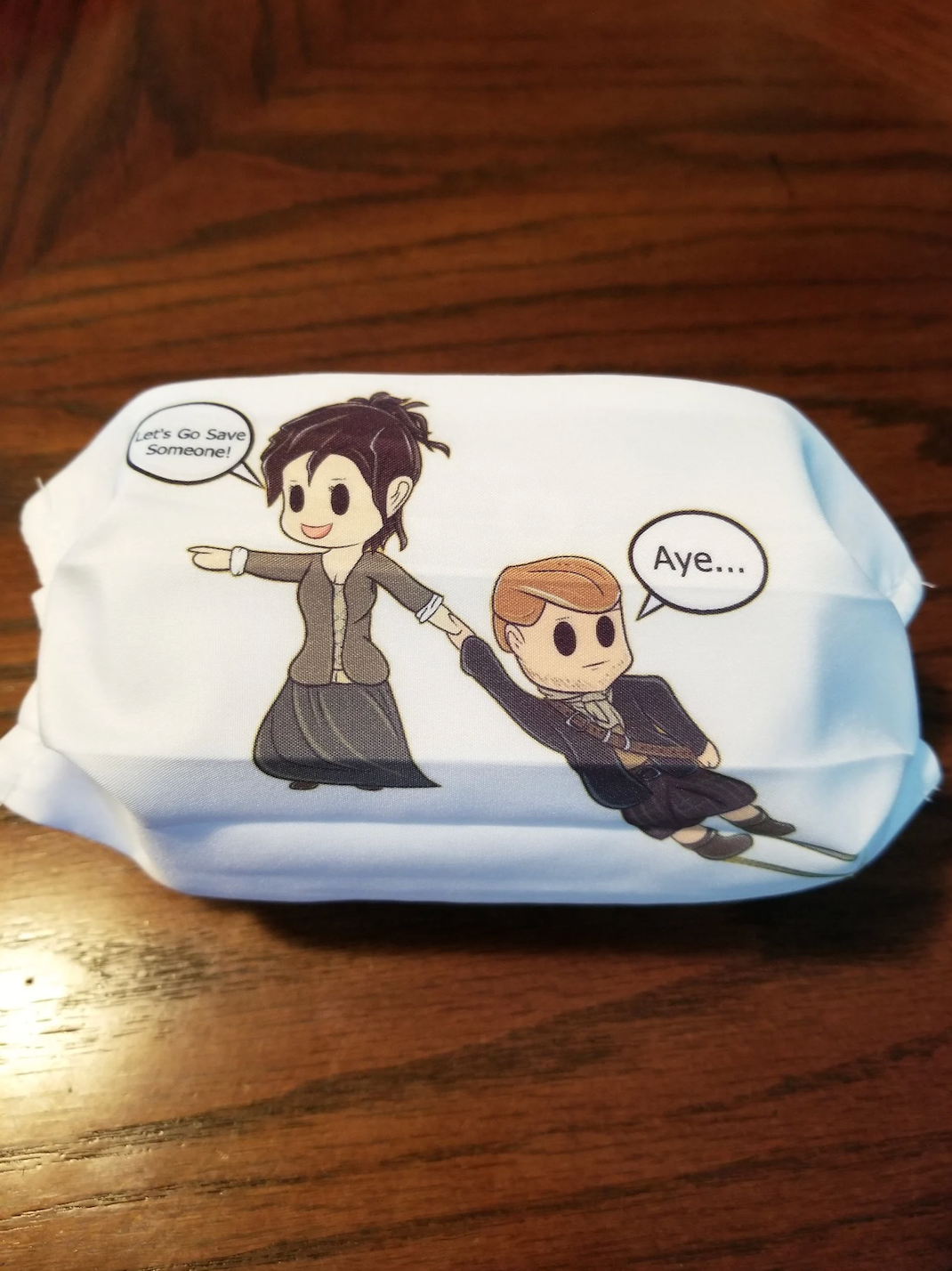 face mask with Jamie and Claire Fraser in the Chibi art style