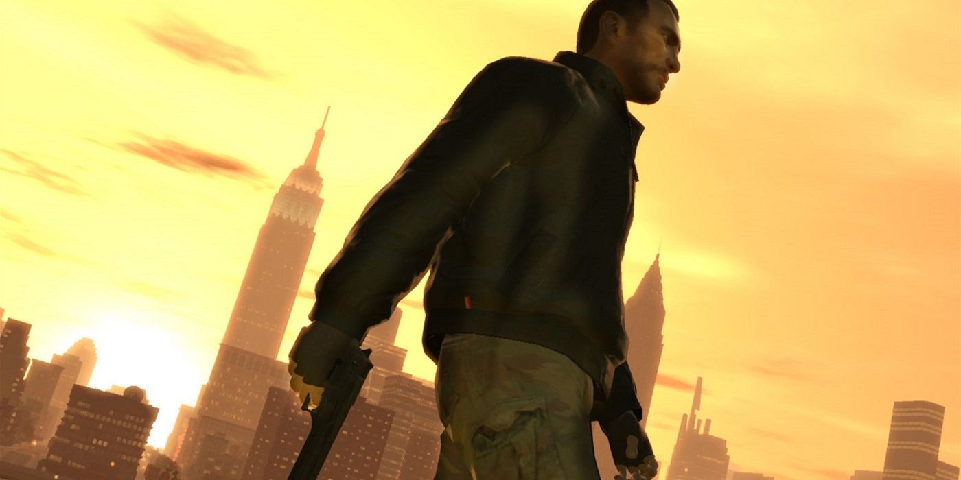 Niko Bellic, Grand Theft Auto 4's protagonist, holding a pistol and standing against the city skyline during the sunrise.