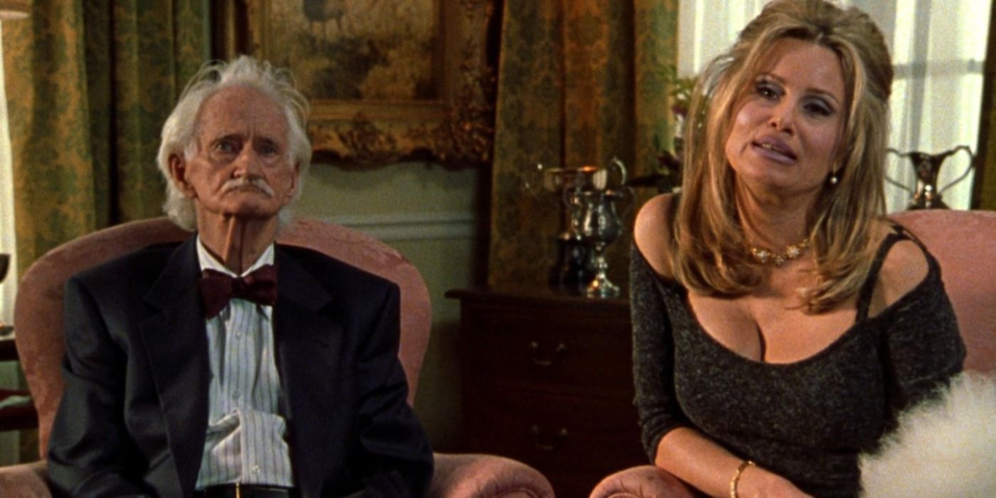 Jennifer Coolidge on couch with old man in Best in Show.