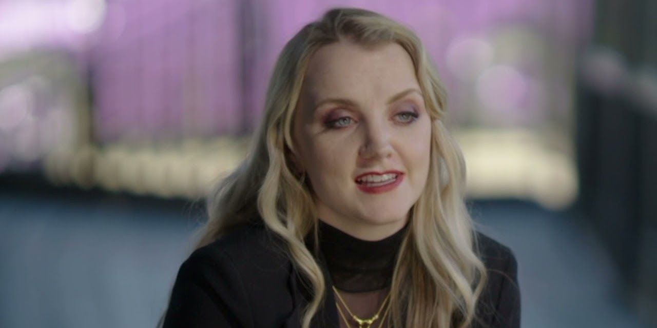 Evanna Lynch talking to the camera in Return to Hogwarts