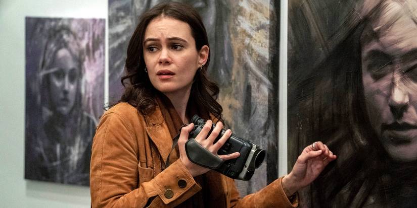 Melody (Dina Shihabi) holding a video camera in Archive 81