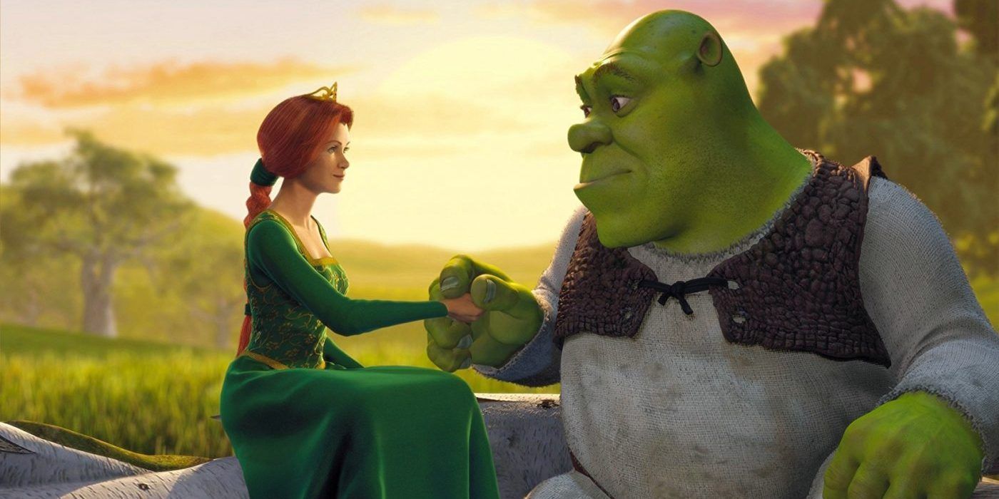 Shrek holds Princess Fiona's hand