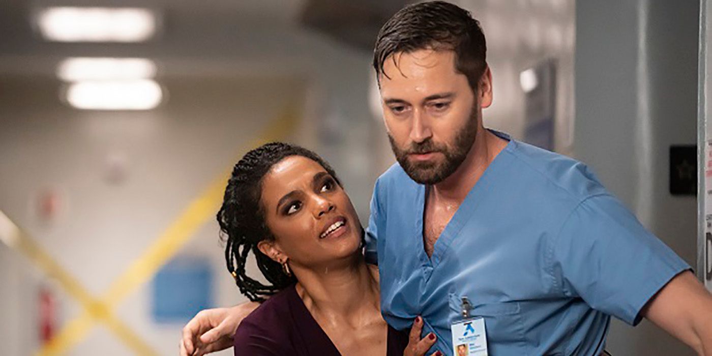 Helen from New Amsterdam holding Max up while he is sweaty and looks ill.