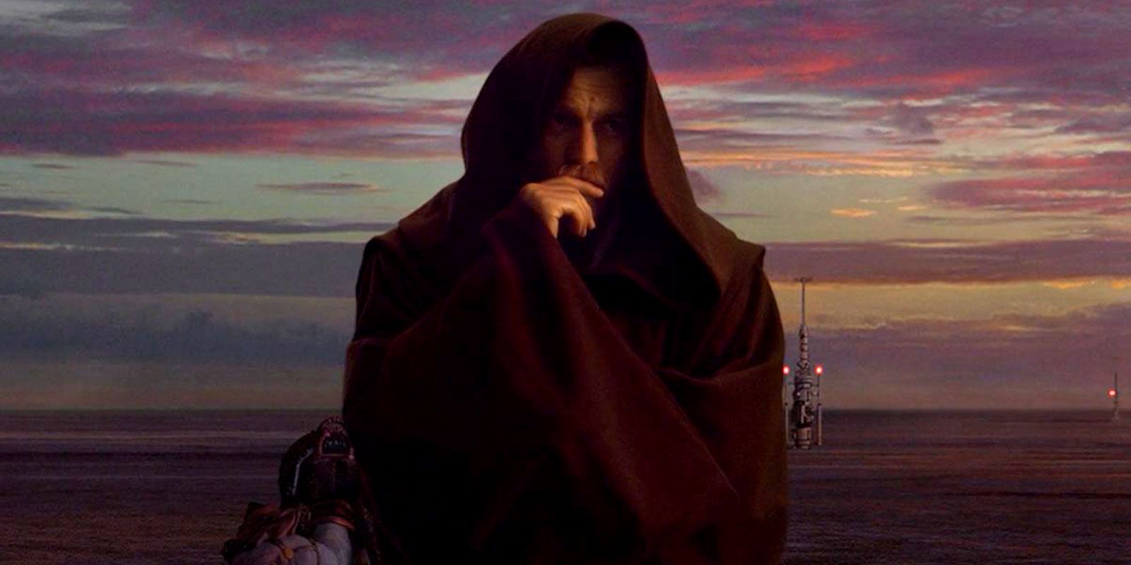 Obi-Wan Kenobi on Tatooine, wearing a hood, under colourful sunset clouds