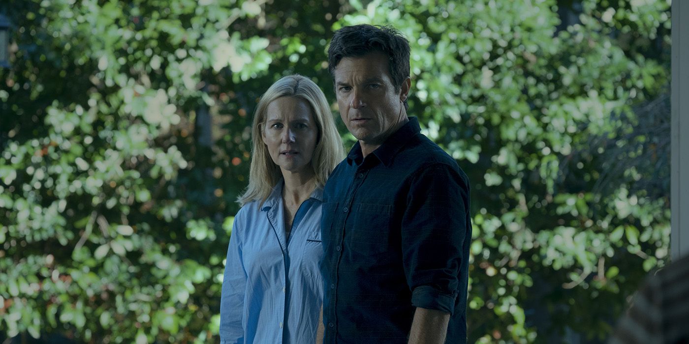 Wendy and Marty standing together, looking scared on Ozark.