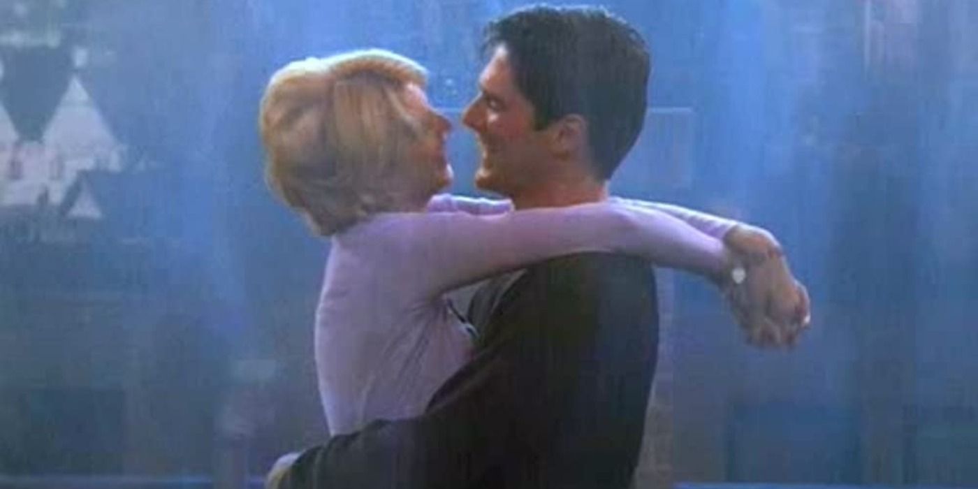 Dharma and Greg happily embracing in the rain in Dharma and Greg