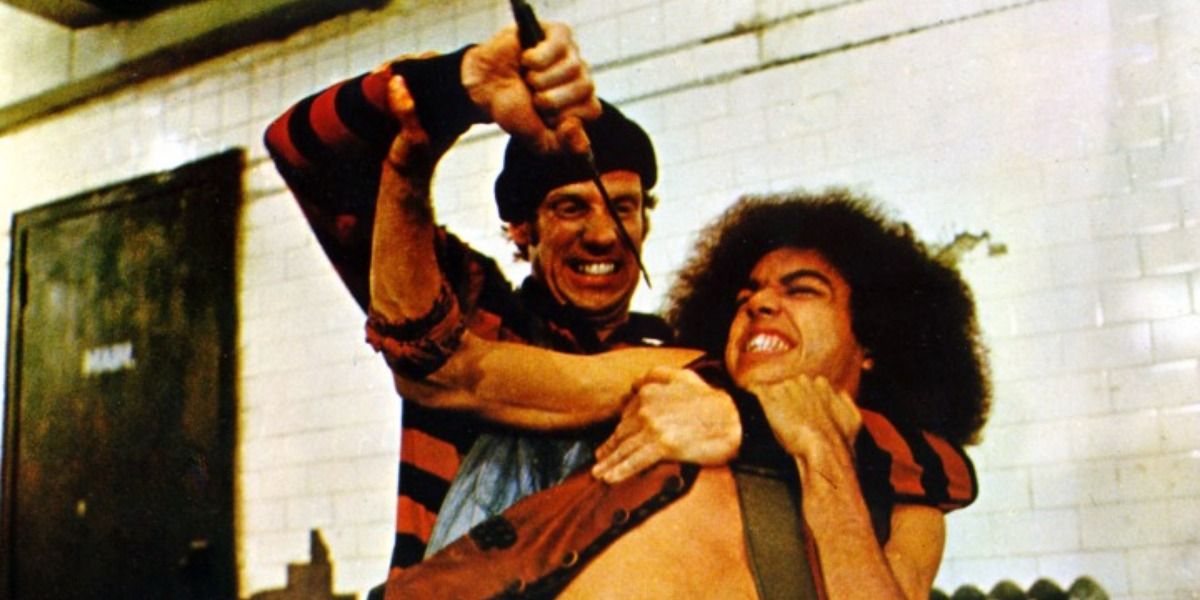 A fight scene with man wielding a knife in The Warriors.