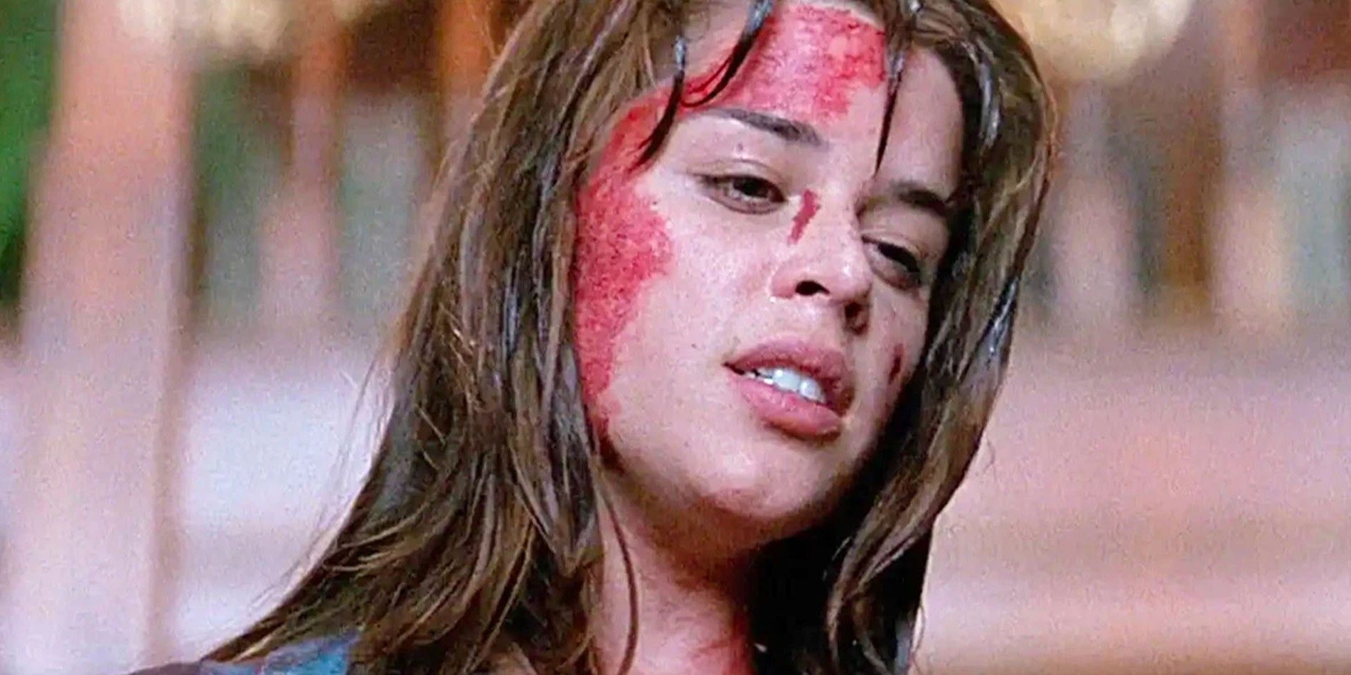 Neve Campbell as Sidney Prescott covered in blood in Scream (1996)